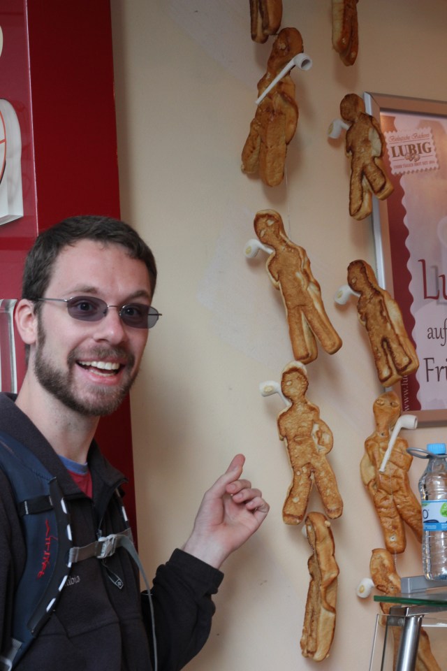 We stopped by a little bakery for breakfast. This is Jon, pointing to some strange little human-shaped pastries.