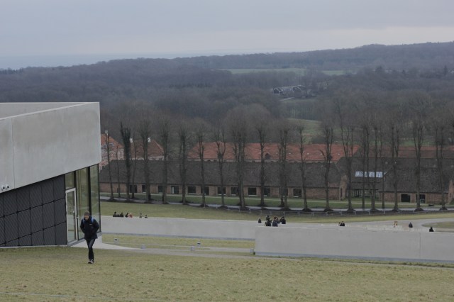 The view turned out to be a very boring field. This is looking back down the slope, where there were at least a few trees and a building to look at.