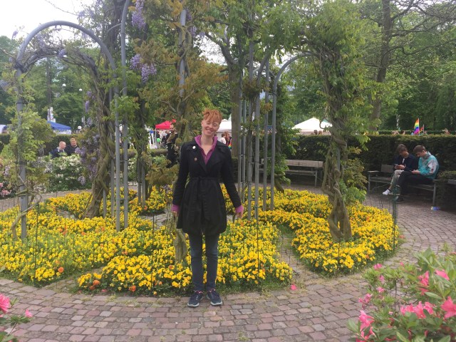 Alison posing in front of a small garden in Officierspladsen at Aarhus, Denmark
